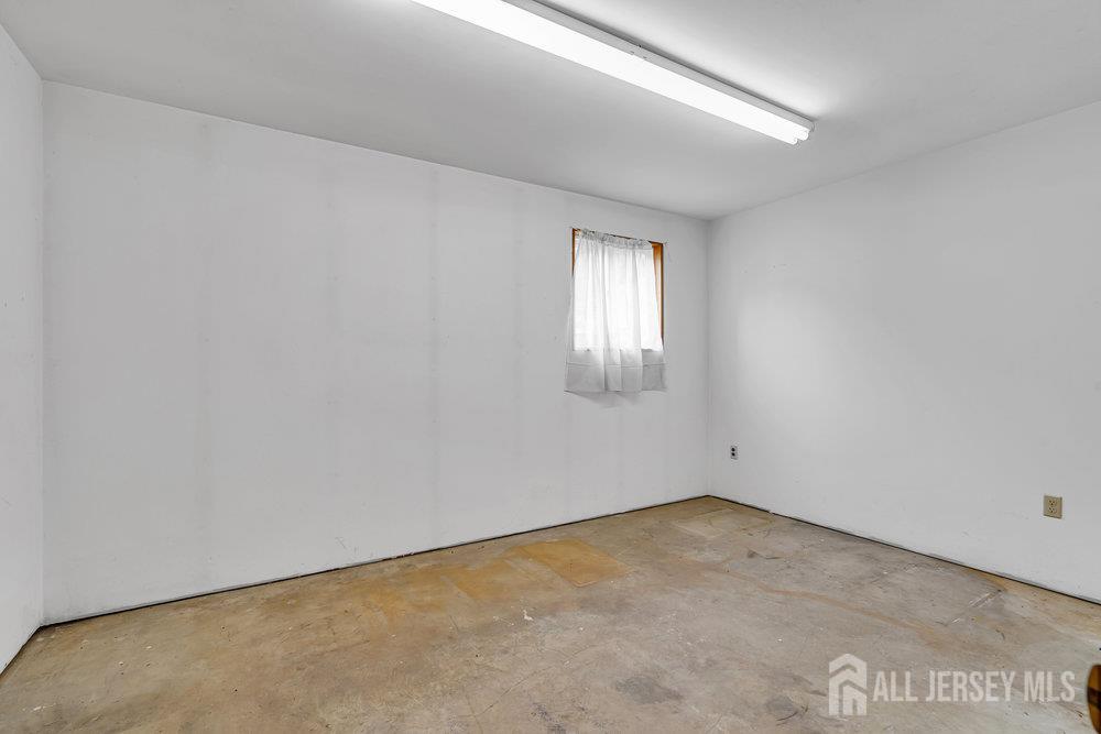 213 East Greystone Road Old Bridge, NJ 08857 - Photo 27 of 32 an empty room with windows