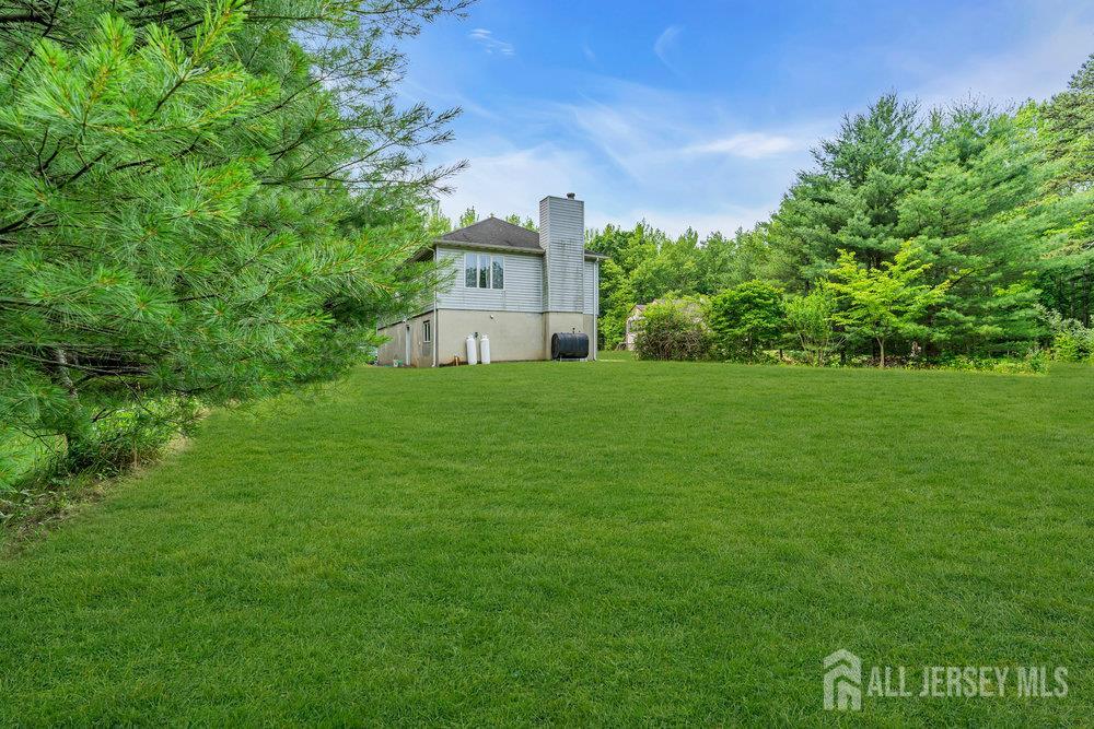 213 East Greystone Road Old Bridge, NJ 08857 - Photo 4 of 32 a view of a house with a big yard