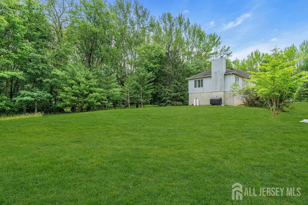 213 East Greystone Road Old Bridge, NJ 08857 - Photo 8 of 32 a view of a house with a yard
