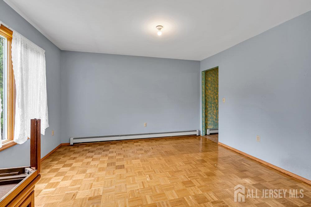 213 East Greystone Road Old Bridge, NJ 08857 - Photo 10 of 32 a view of an empty room with a window