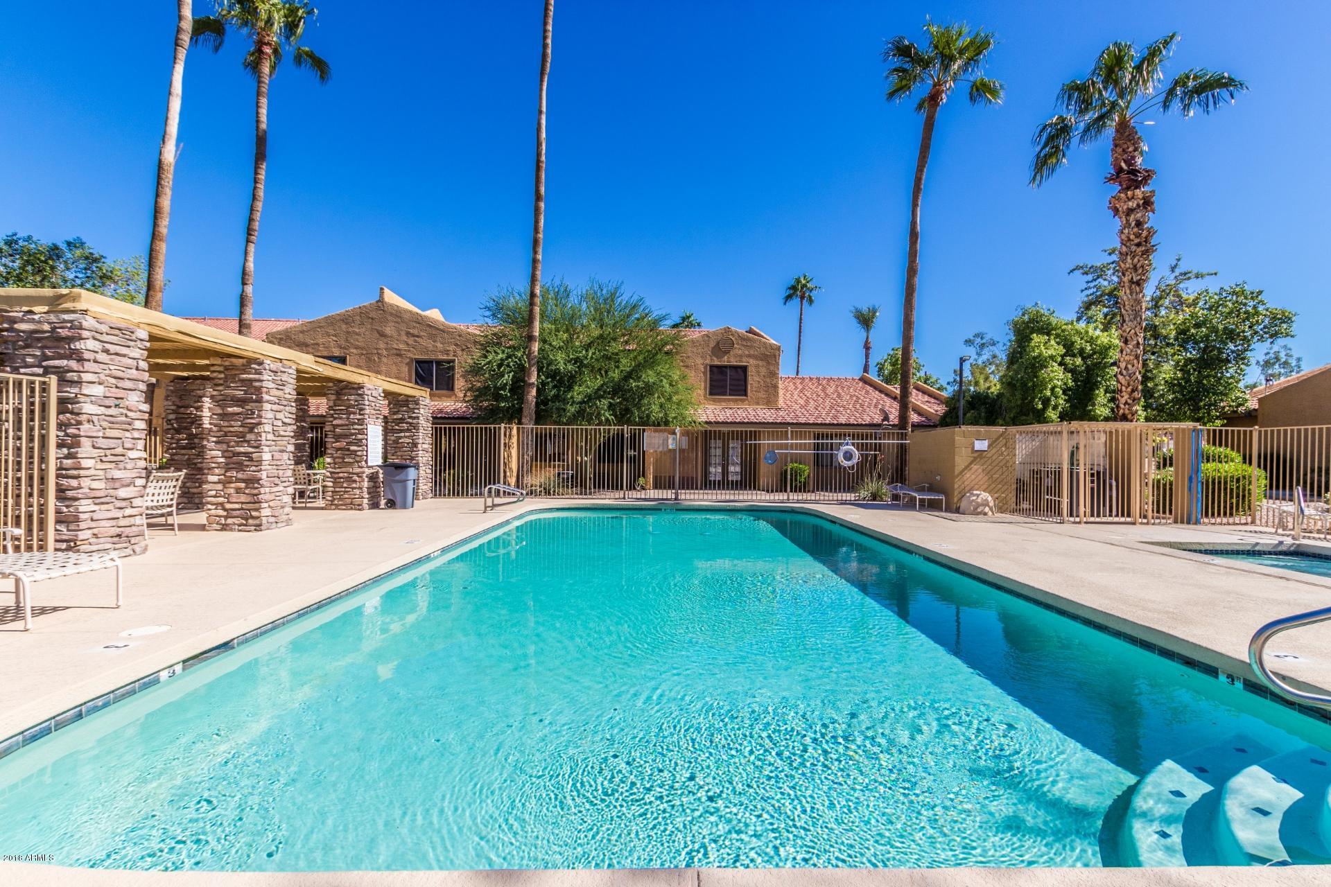 3511 East Baseline Road, Unit 1082 Phoenix, AZ 85042 - Photo 21 of 23 a view of a house with a swimming pool