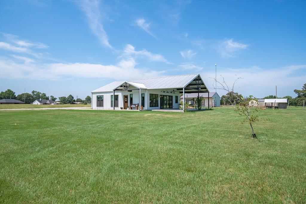 a view of a house with a big yard
