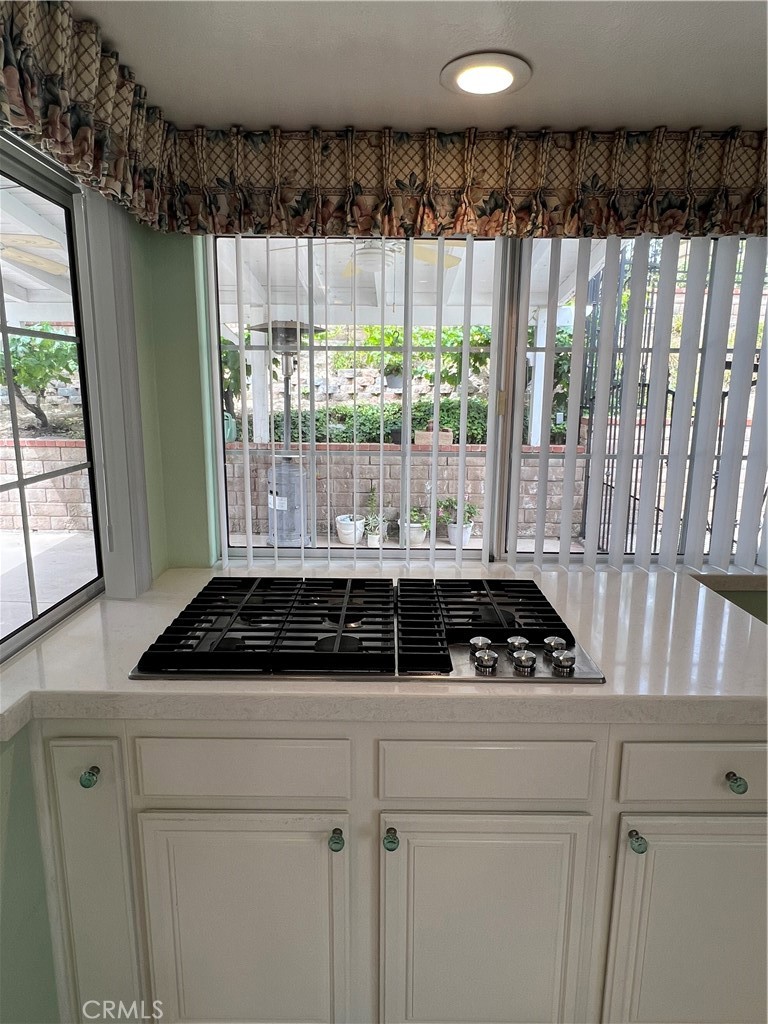 25225 Sagecrest Circle Stevenson Ranch, CA 91381 - Photo 23 of 50 5-burner gas stove top w/ down draft exhaust