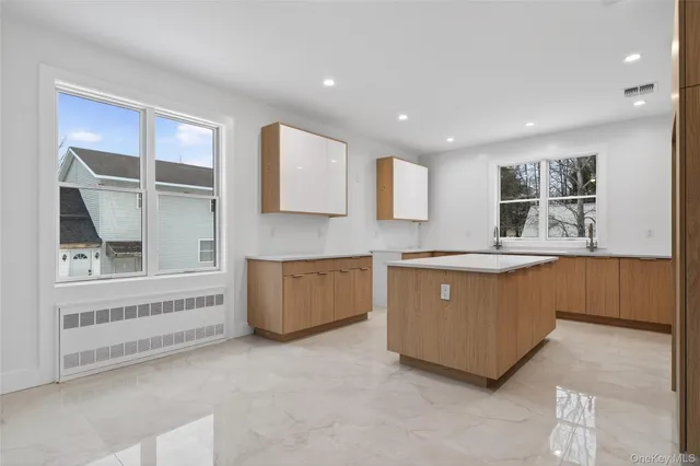 a kitchen with stainless steel appliances granite countertop a sink and cabinets