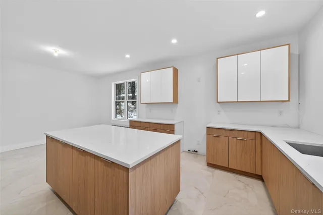 a kitchen that has a sink and a stove in it