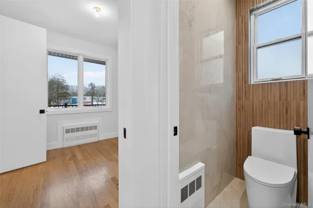 a bathroom with a toilet and a sink