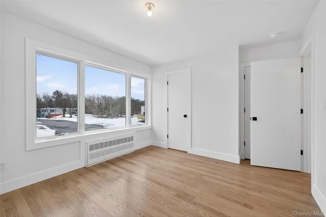 a view of an empty room with a window