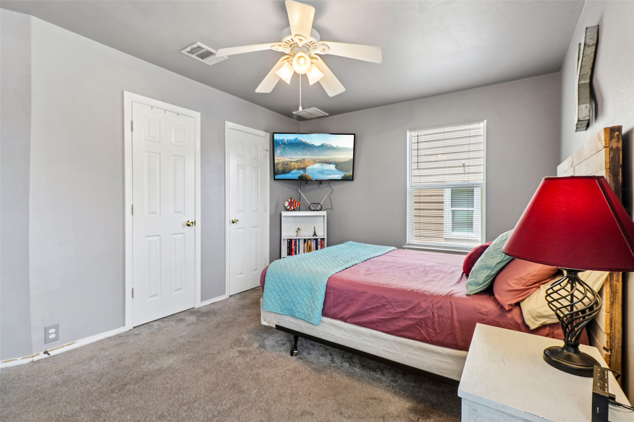 311 A Utterback Kyle, TX 78640 - Photo 18 of 40 a bedroom with a bed and a window