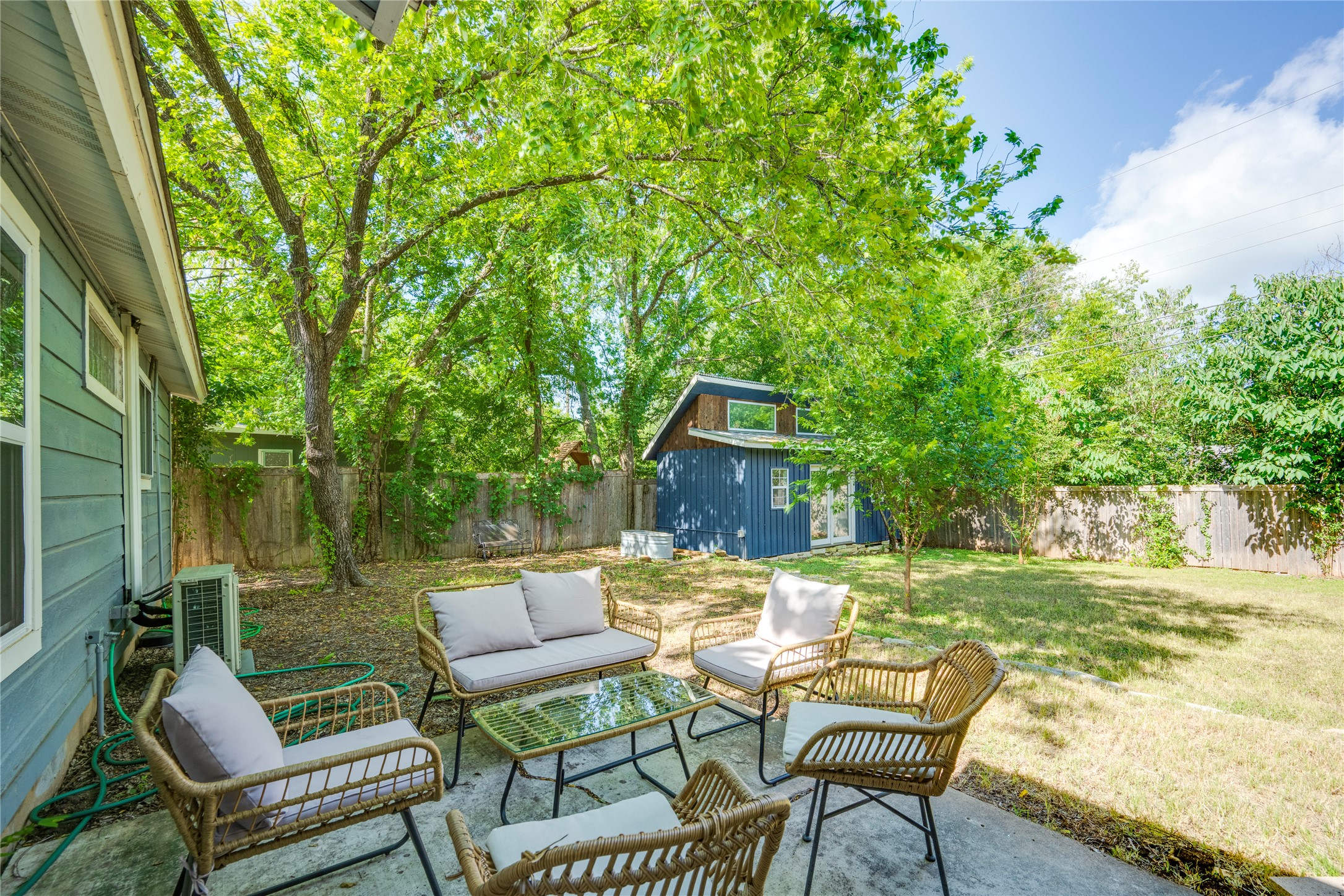 5300 Halmark Drive Austin, TX 78723 - Photo 35 of 40 A private backyard oasis with mature trees and a charming shed offers a perfect retreat.