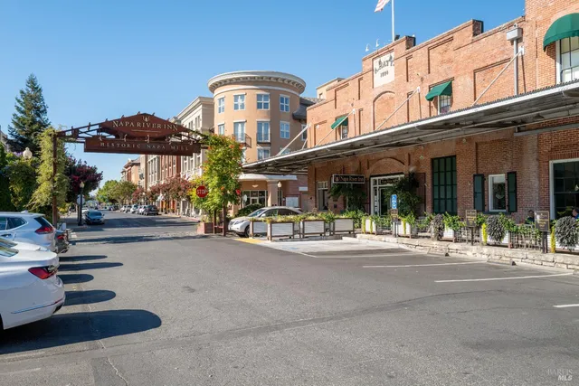 a view of a building with sitting area and furniture