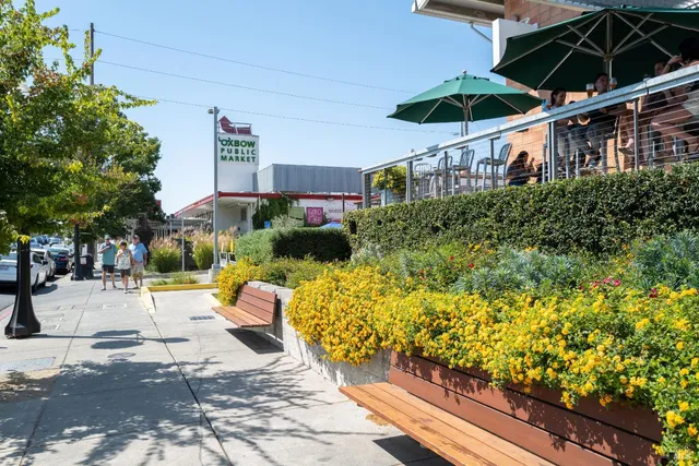 a view of a house with swimming pool and sitting area