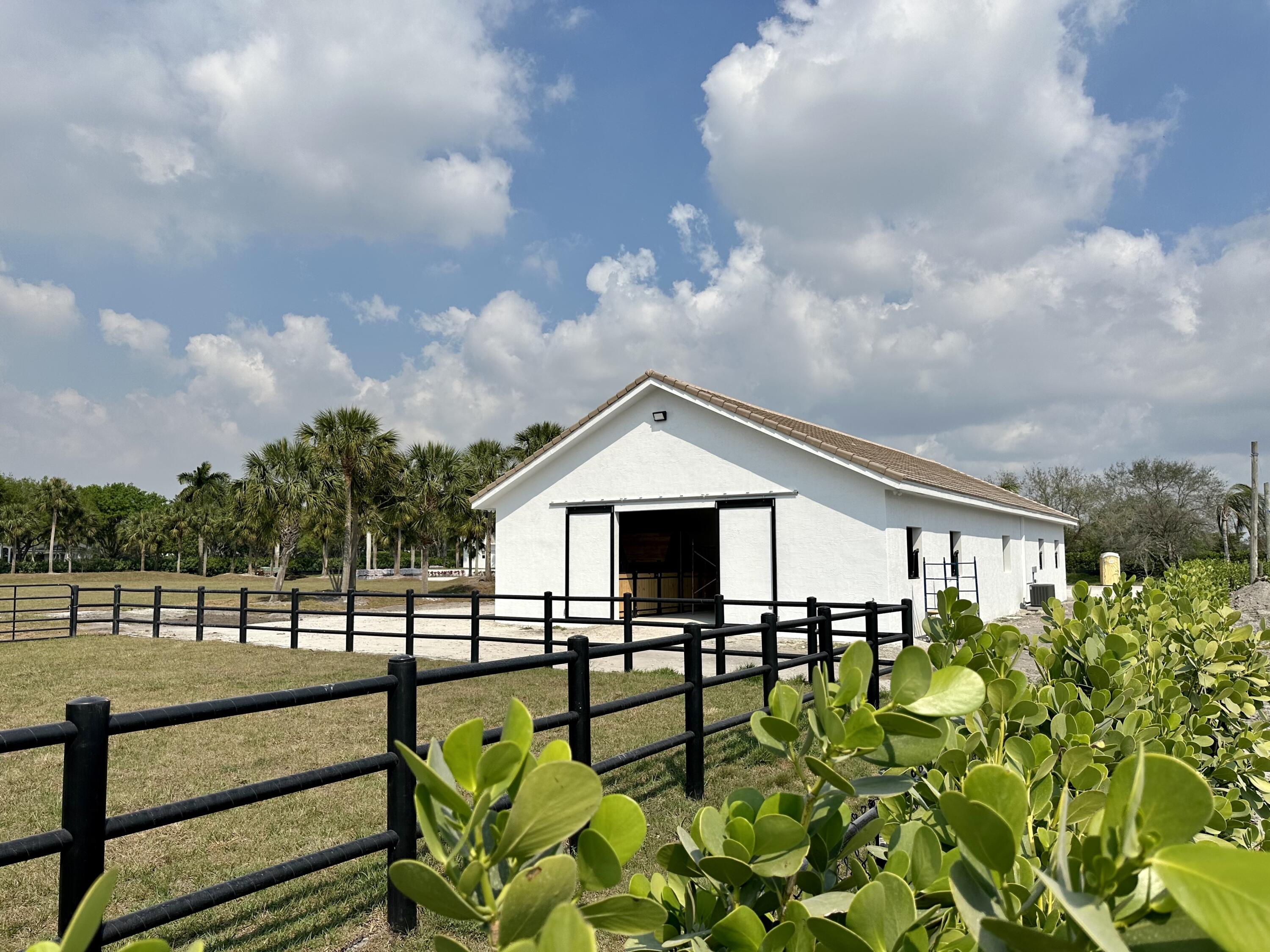 13250 Southfields Road Wellington, FL 33414 - Photo 1 of 72 8 stall barn/8 stall tent