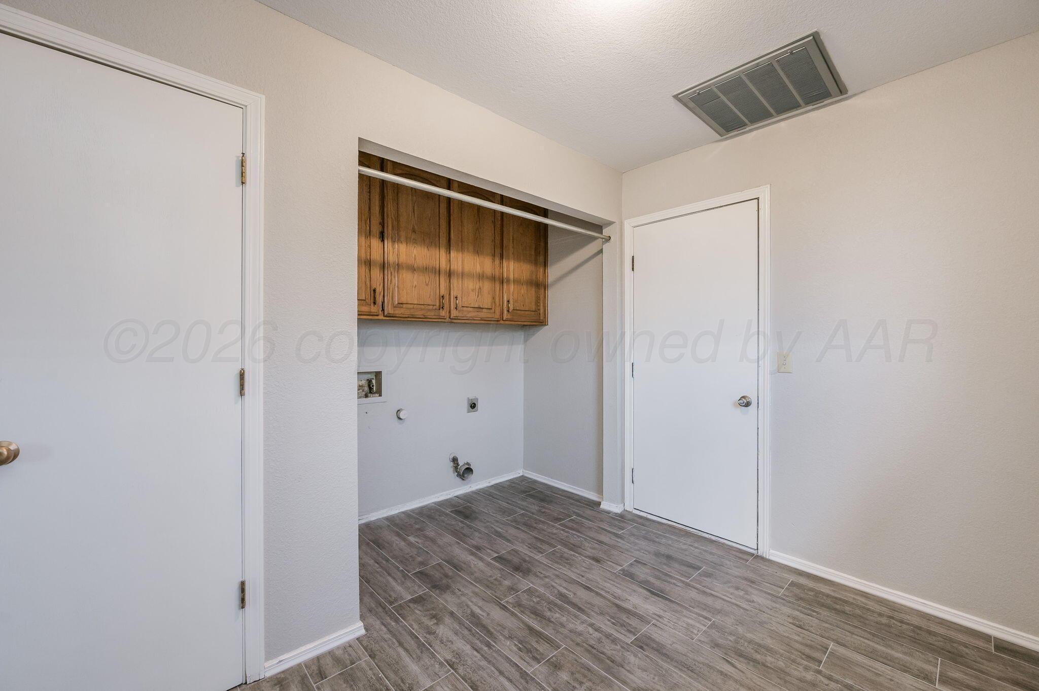 6000 Hampton Drive Amarillo, TX 79109 - Photo 17 of 19 a view of hallway with wooden floor