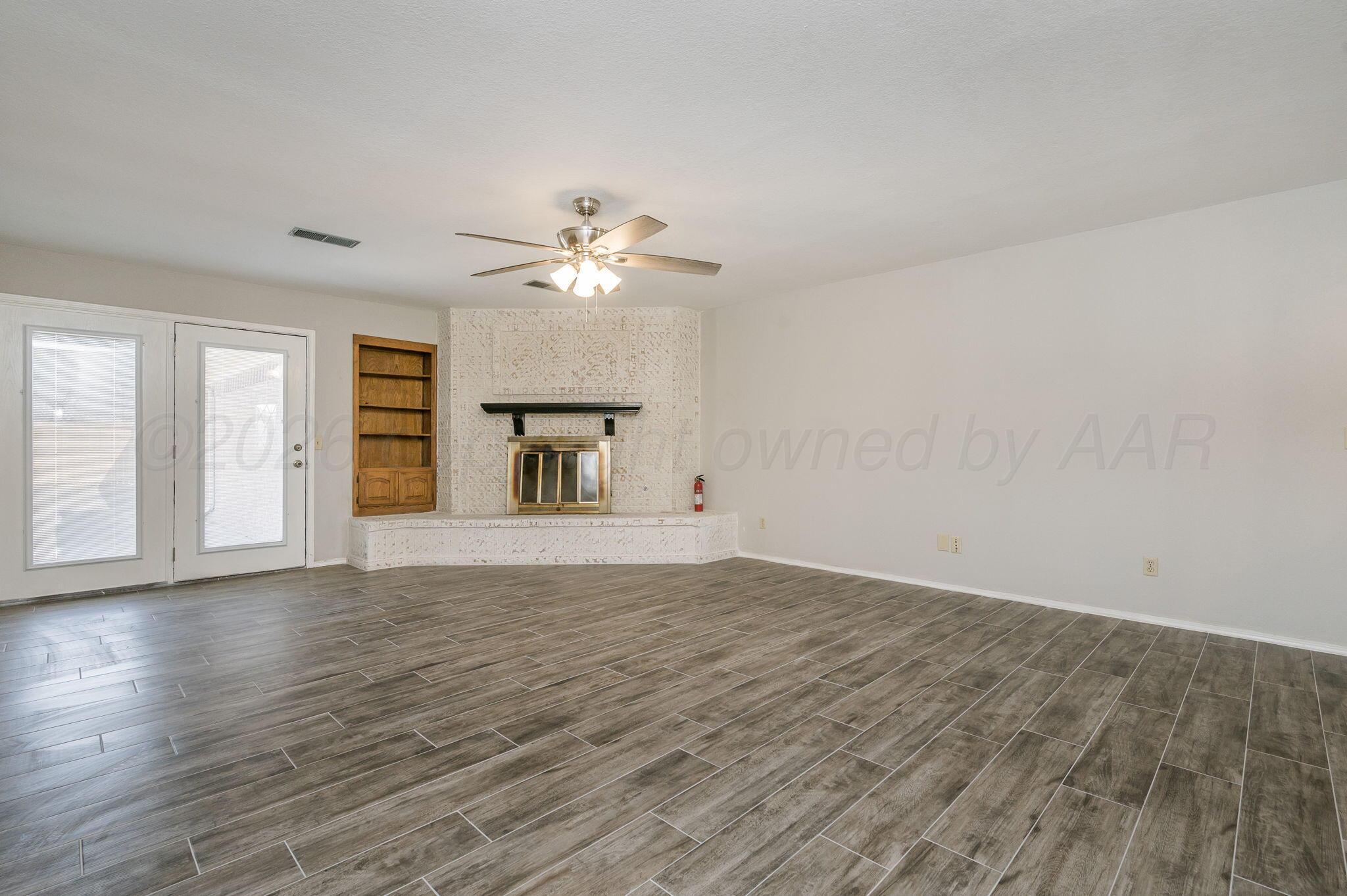 6000 Hampton Drive Amarillo, TX 79109 - Photo 3 of 19 a view of an empty room with a window