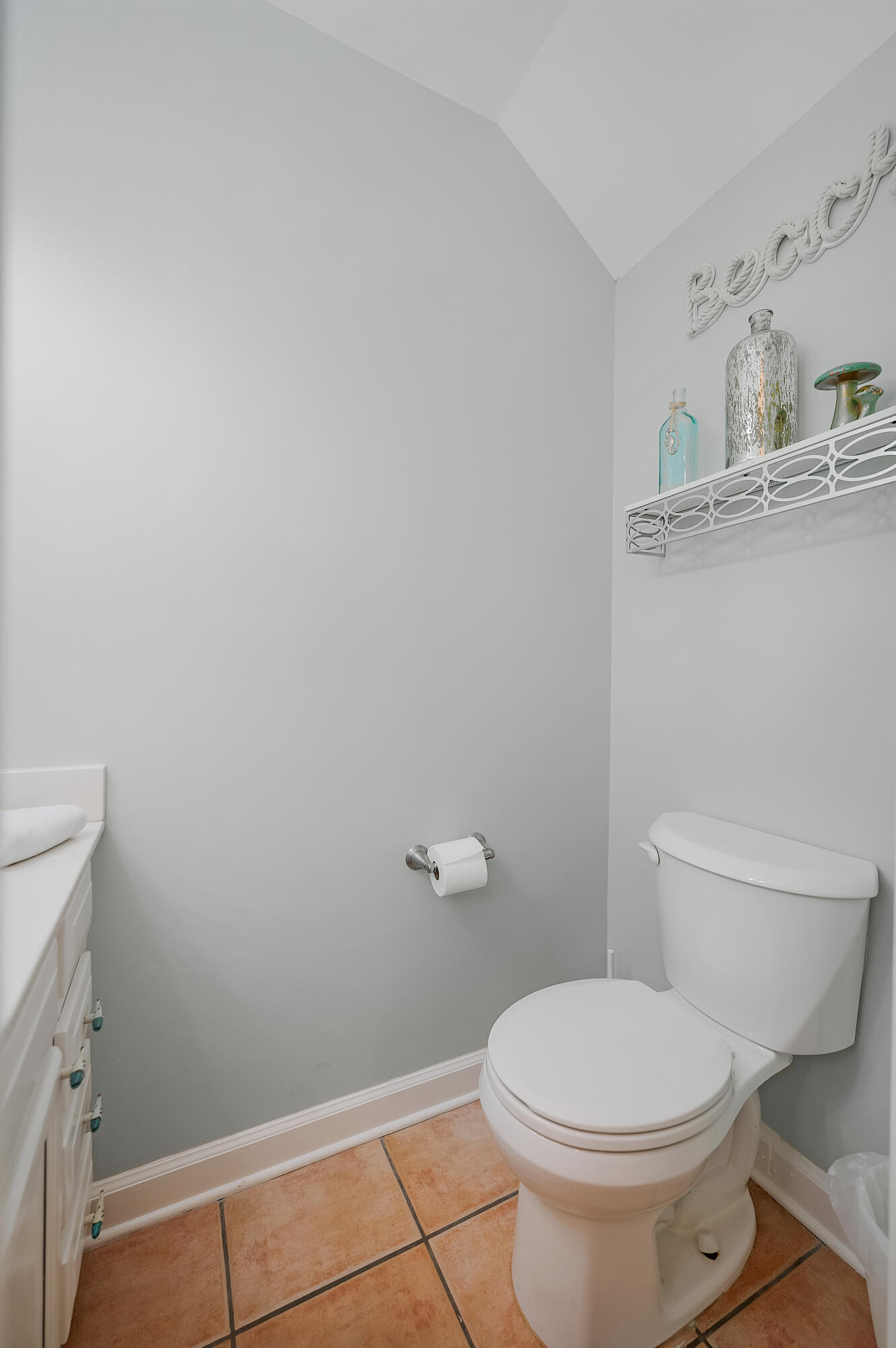 241 Ellis Road, Unit 43 Miramar Beach, FL 32550 - Photo 17 of 43 a white toilet sitting next to a bathroom sink