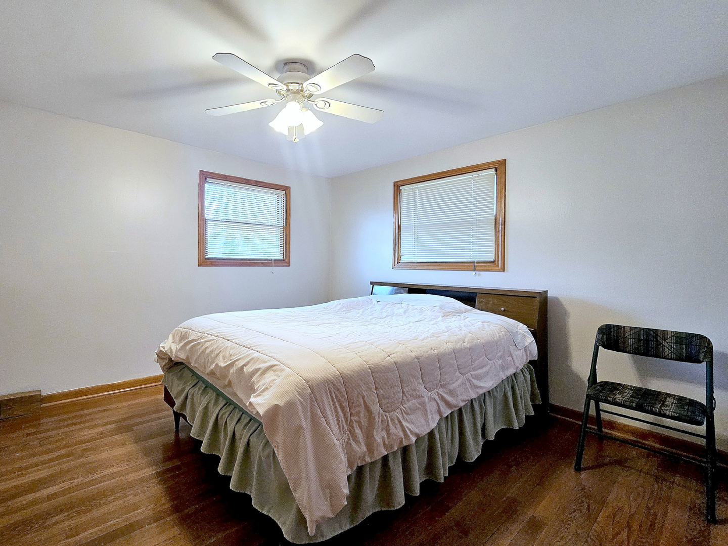 357 North Pioneer Drive Addison, IL 60101 - Photo 11 of 26 a bedroom with a bed and a chandelier