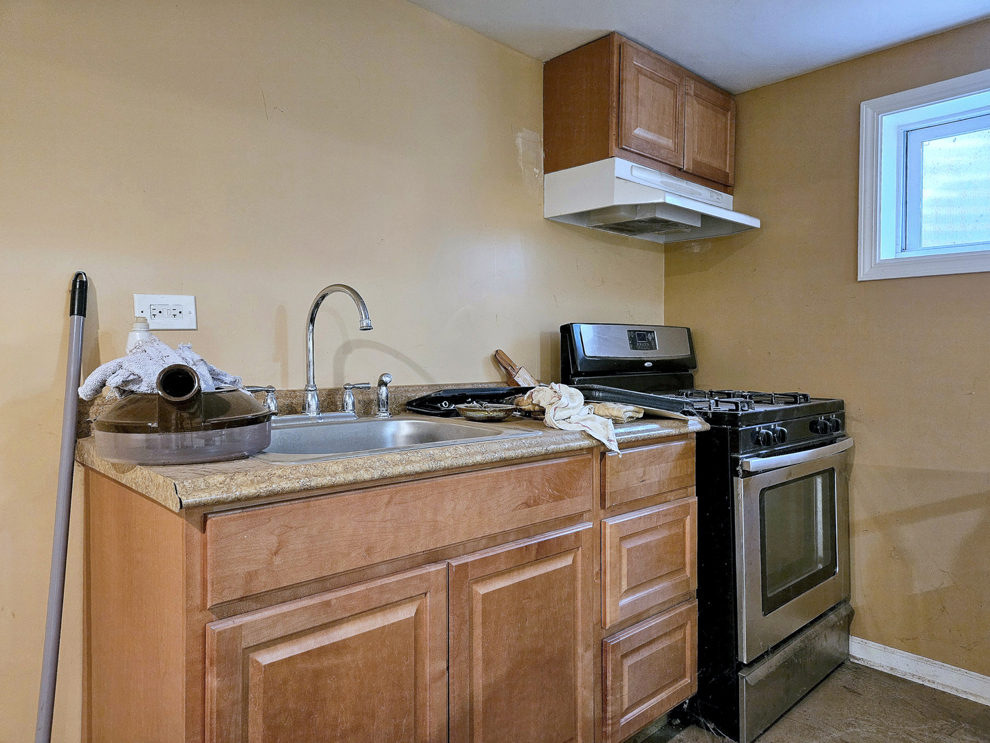 357 North Pioneer Drive Addison, IL 60101 - Photo 18 of 26 a kitchen with stainless steel appliances granite countertop a sink and a stove with a white countertops