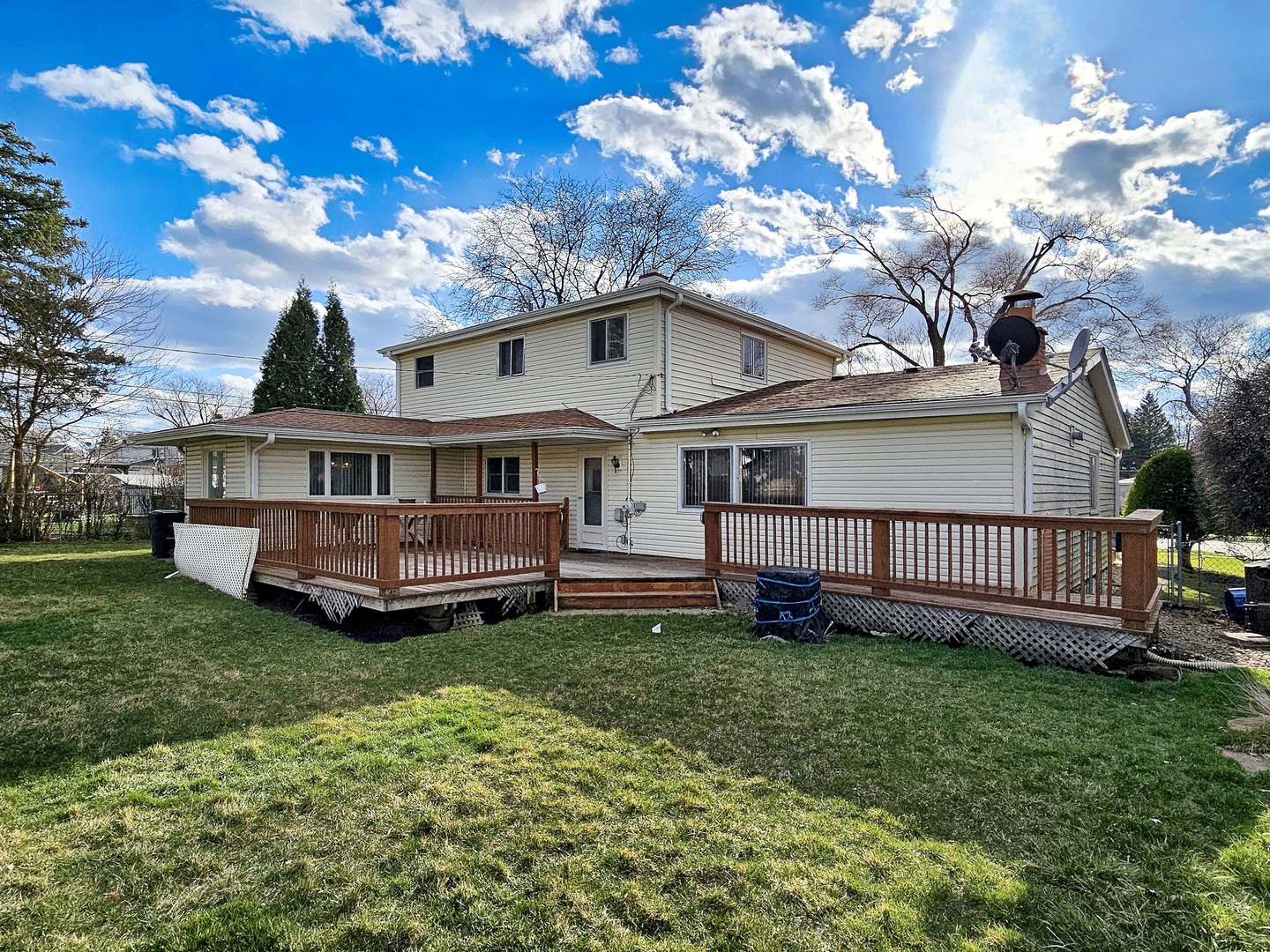 357 North Pioneer Drive Addison, IL 60101 - Photo 19 of 26 a view of a house with a big yard and large tree