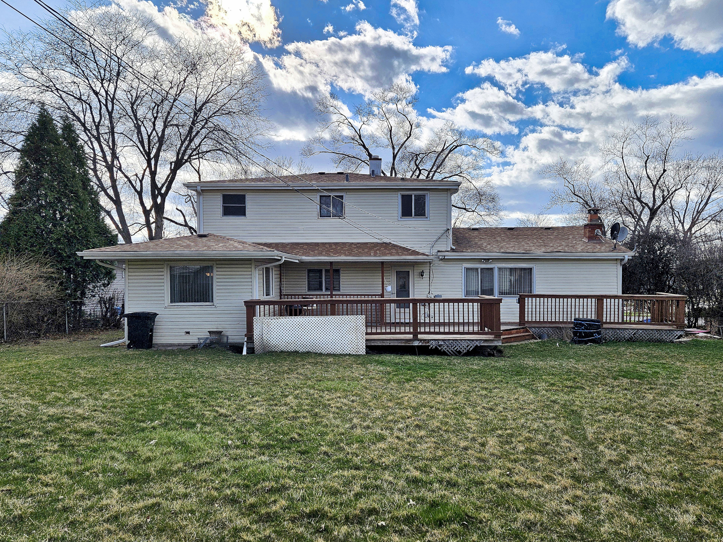 357 North Pioneer Drive Addison, IL 60101 - Photo 20 of 26 a view of a house with a yard and sitting area