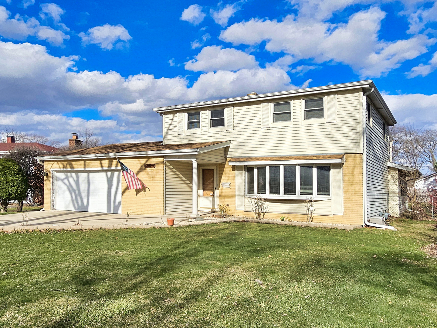 357 North Pioneer Drive Addison, IL 60101 - Photo 2 of 26 a front view of a house with a garden