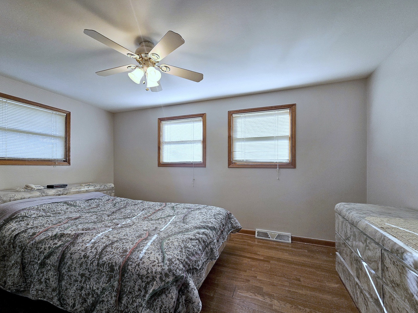 357 North Pioneer Drive Addison, IL 60101 - Photo 10 of 26 a bedroom with a bed and a chandelier