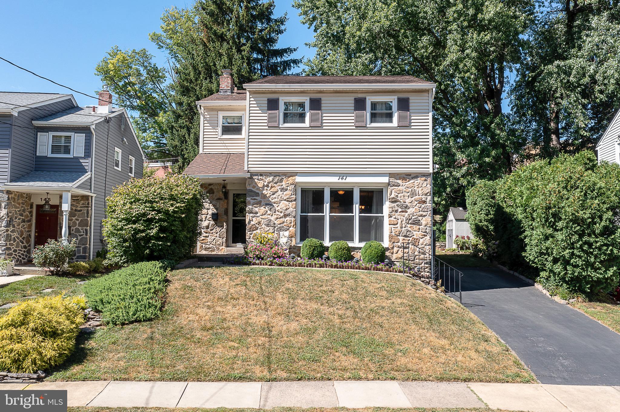 141 Lewis Road Havertown, PA 19083 - Photo 1 of 33 a front view of a house with a yard and garage