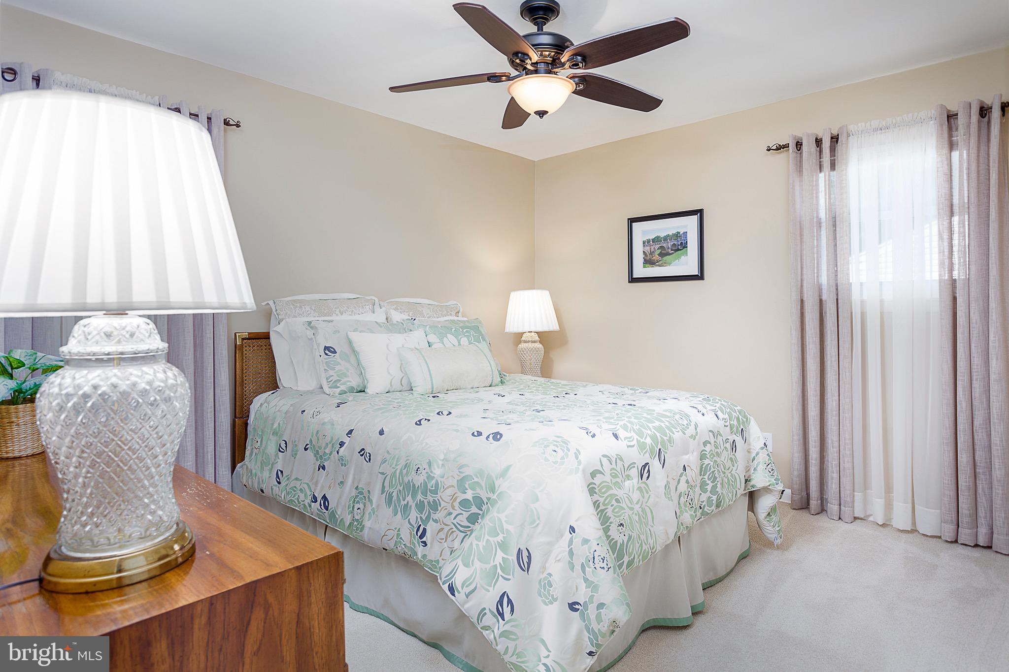141 Lewis Road Havertown, PA 19083 - Photo 14 of 33 a bedroom with a bed and a chair
