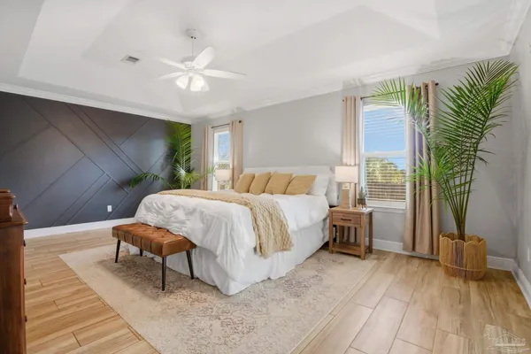 a bedroom with a bed and a mirror