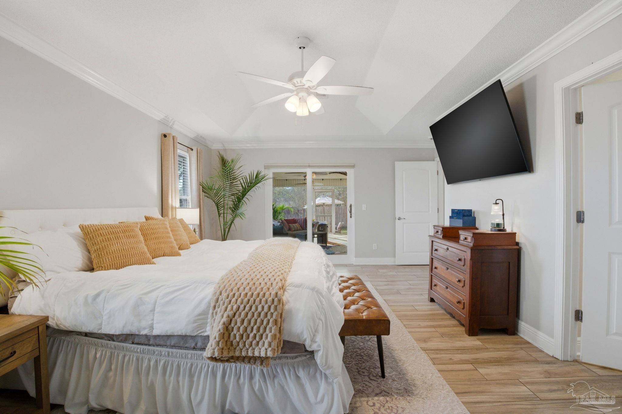 4249 Spindlewick Drive Pace, FL 32571 - Photo 13 of 26 a bedroom with a bed and a flat screen tv