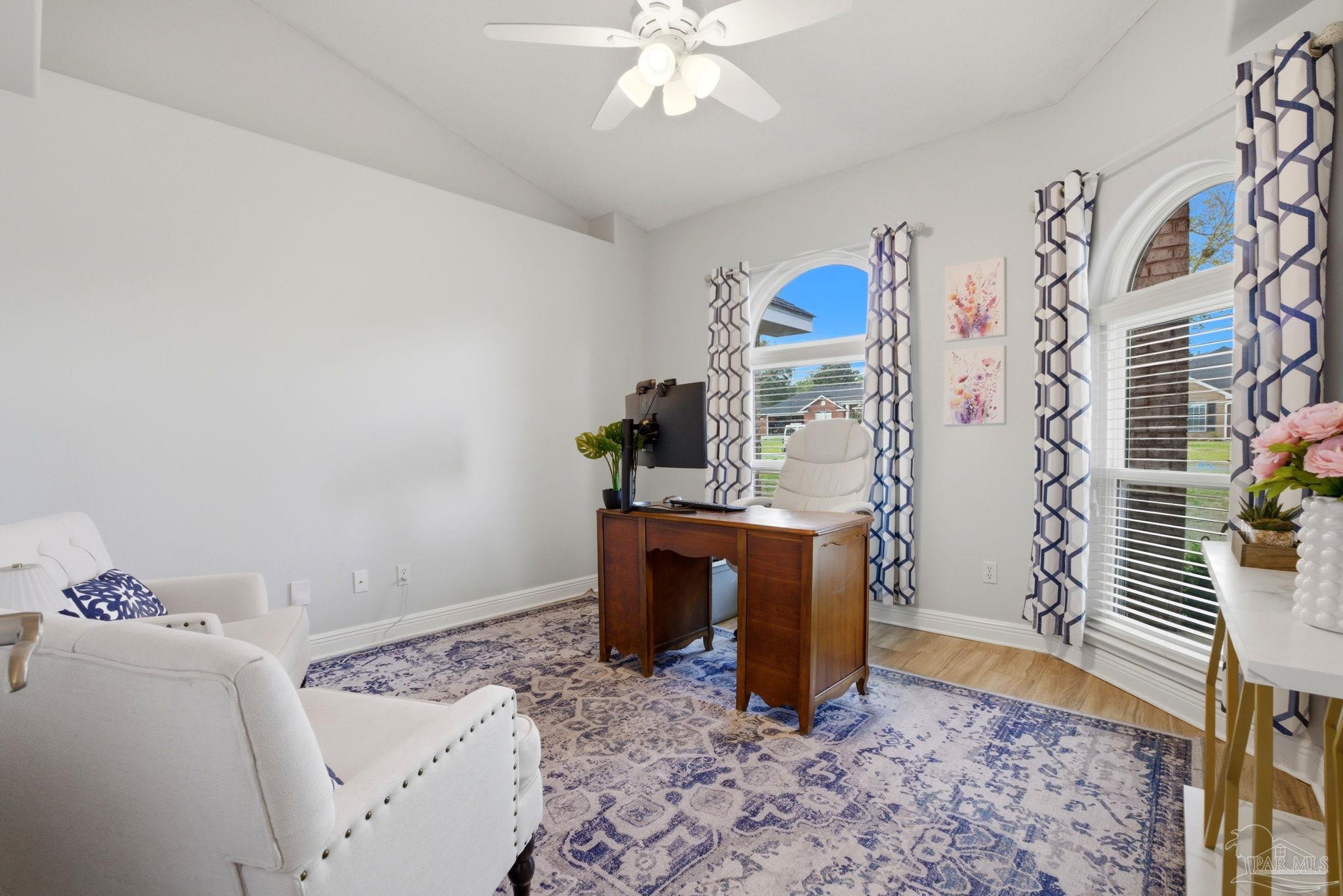 4249 Spindlewick Drive Pace, FL 32571 - Photo 17 of 26 a bedroom with a bed and a chandelier