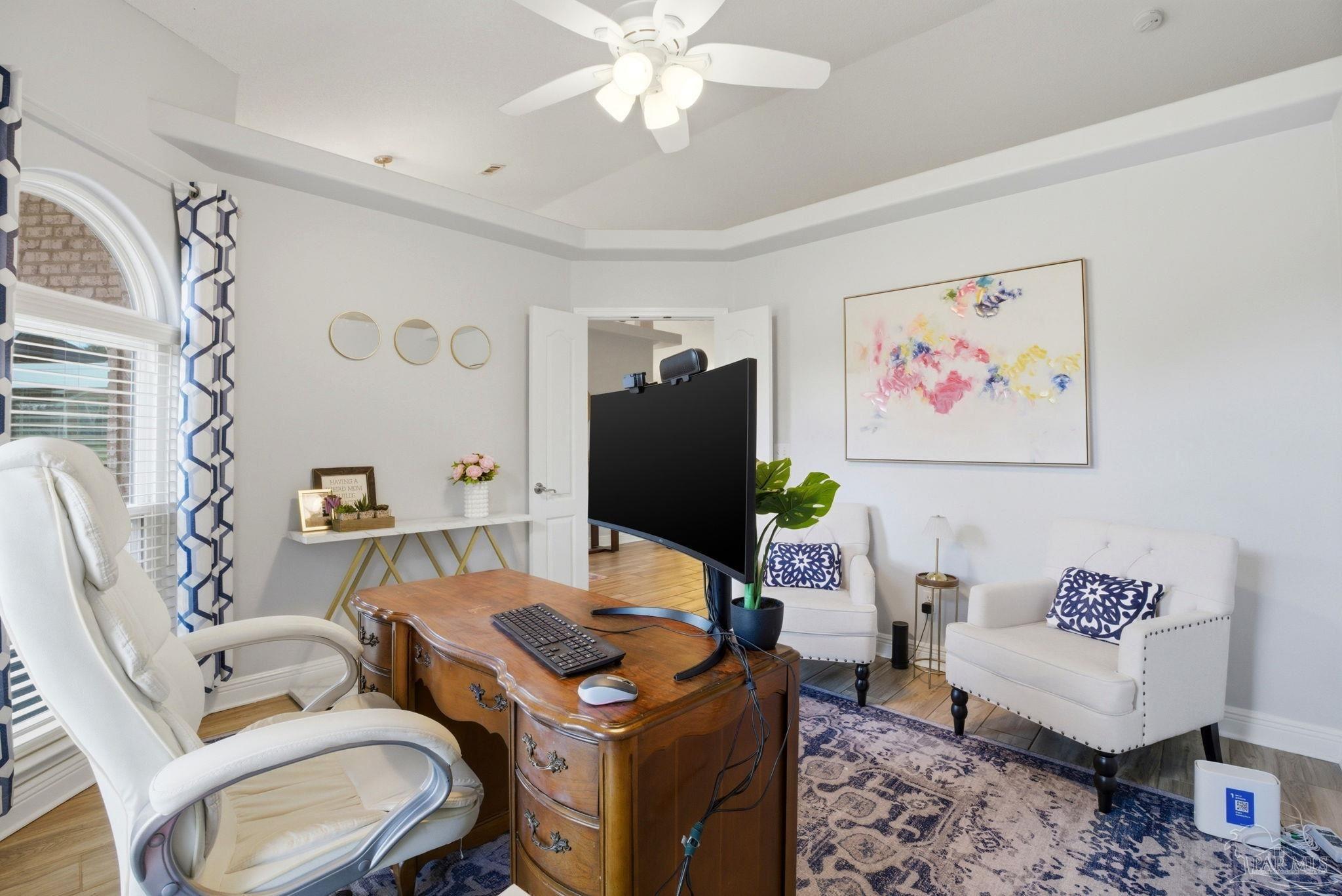 4249 Spindlewick Drive Pace, FL 32571 - Photo 18 of 26 a living room with furniture and a flat screen tv