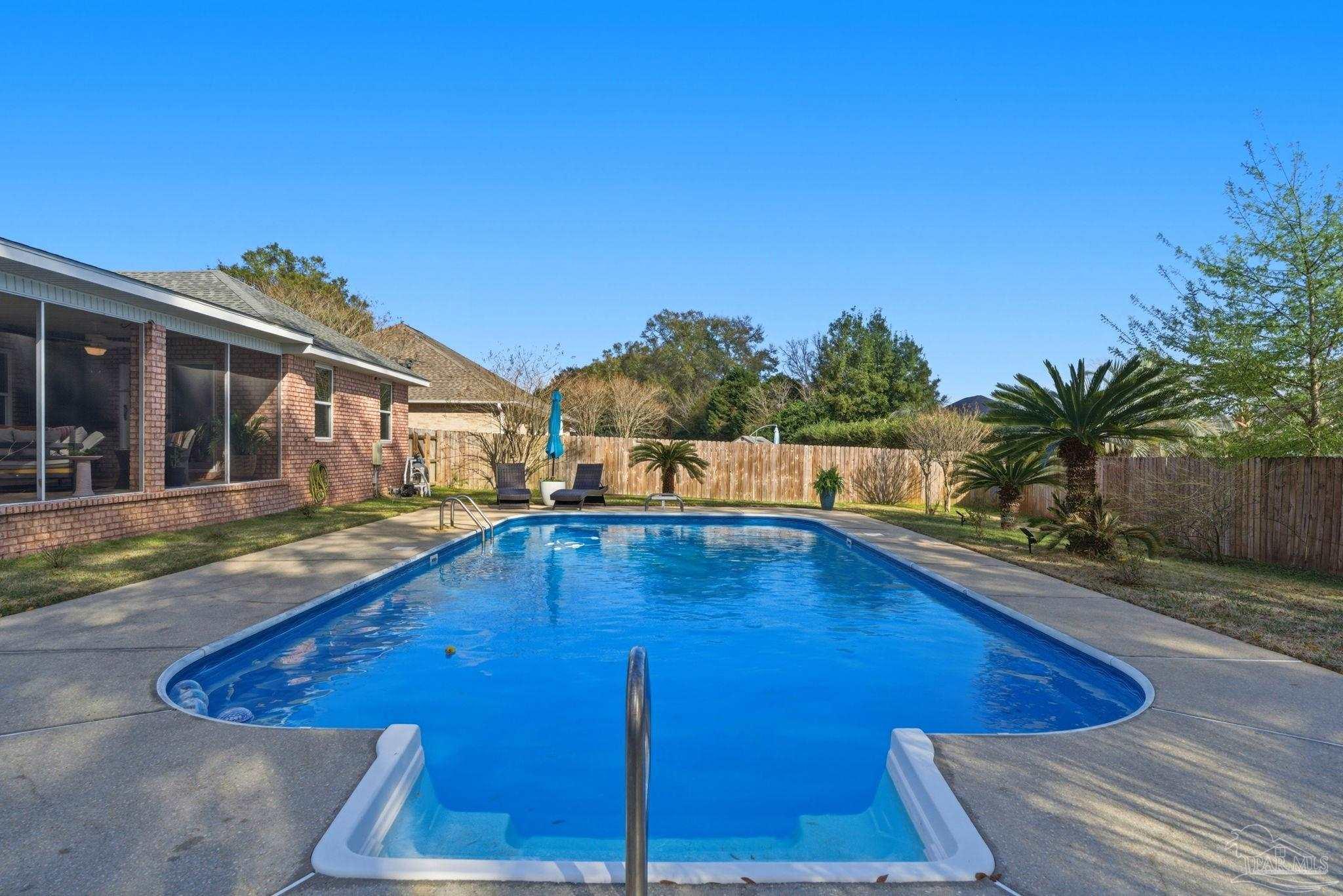 4249 Spindlewick Drive Pace, FL 32571 - Photo 23 of 26 a view of a house with swimming pool