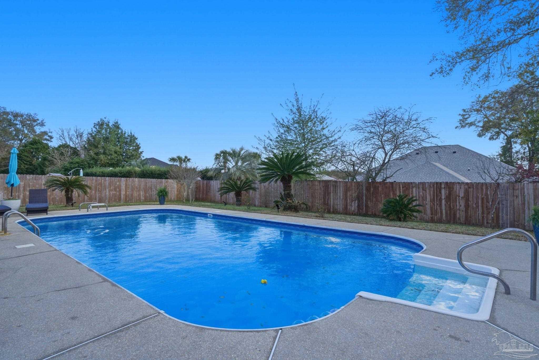 4249 Spindlewick Drive Pace, FL 32571 - Photo 24 of 26 swimming pool view with a seating space
