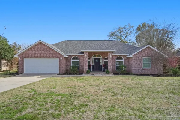 a front view of a house with yard