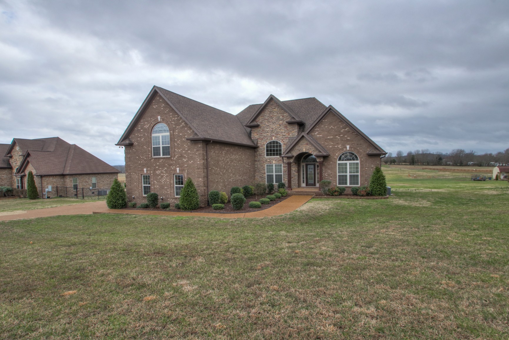 678 Academy Road Lebanon, TN 37087 - Photo 3 of 48 a front view of a house with garden