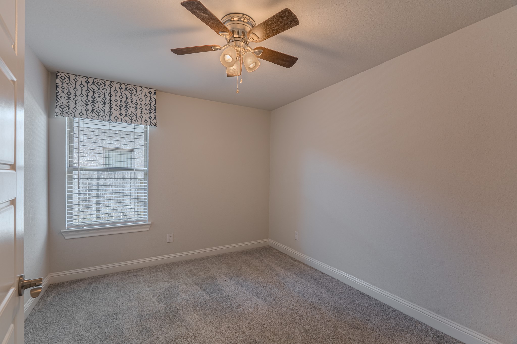 9840 Sweet Flag Court Conroe, TX 77385 - Photo 49 of 50 Each bedroom is thoughtfully placed to provide privacy while maintaining a cohesive and functional floor plan.
