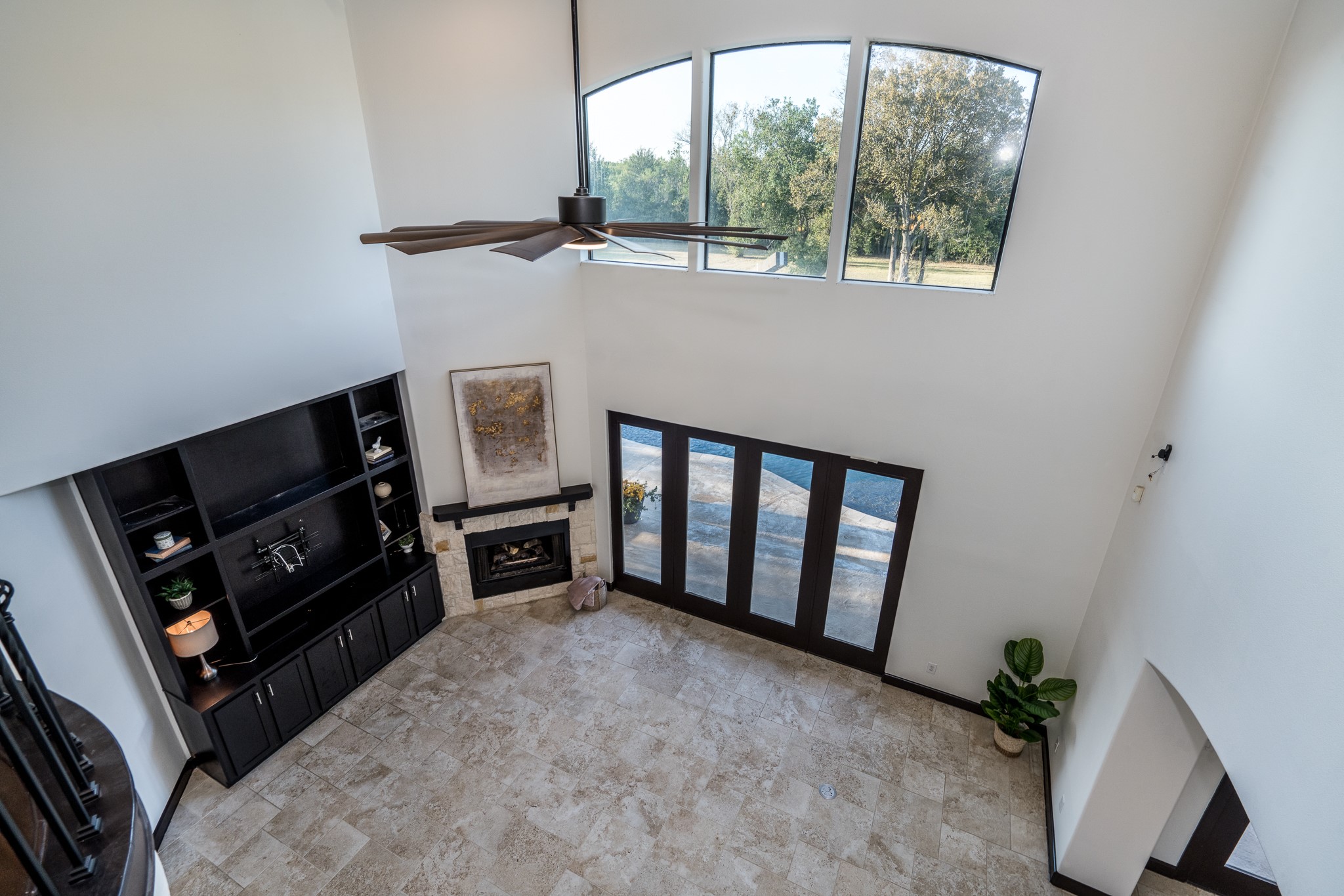 12748 Roy Road Pearland, TX 77581 - Photo 22 of 50 The lofty space has oversized ceramic tile flooring that continues into the breakfast and kitchen.