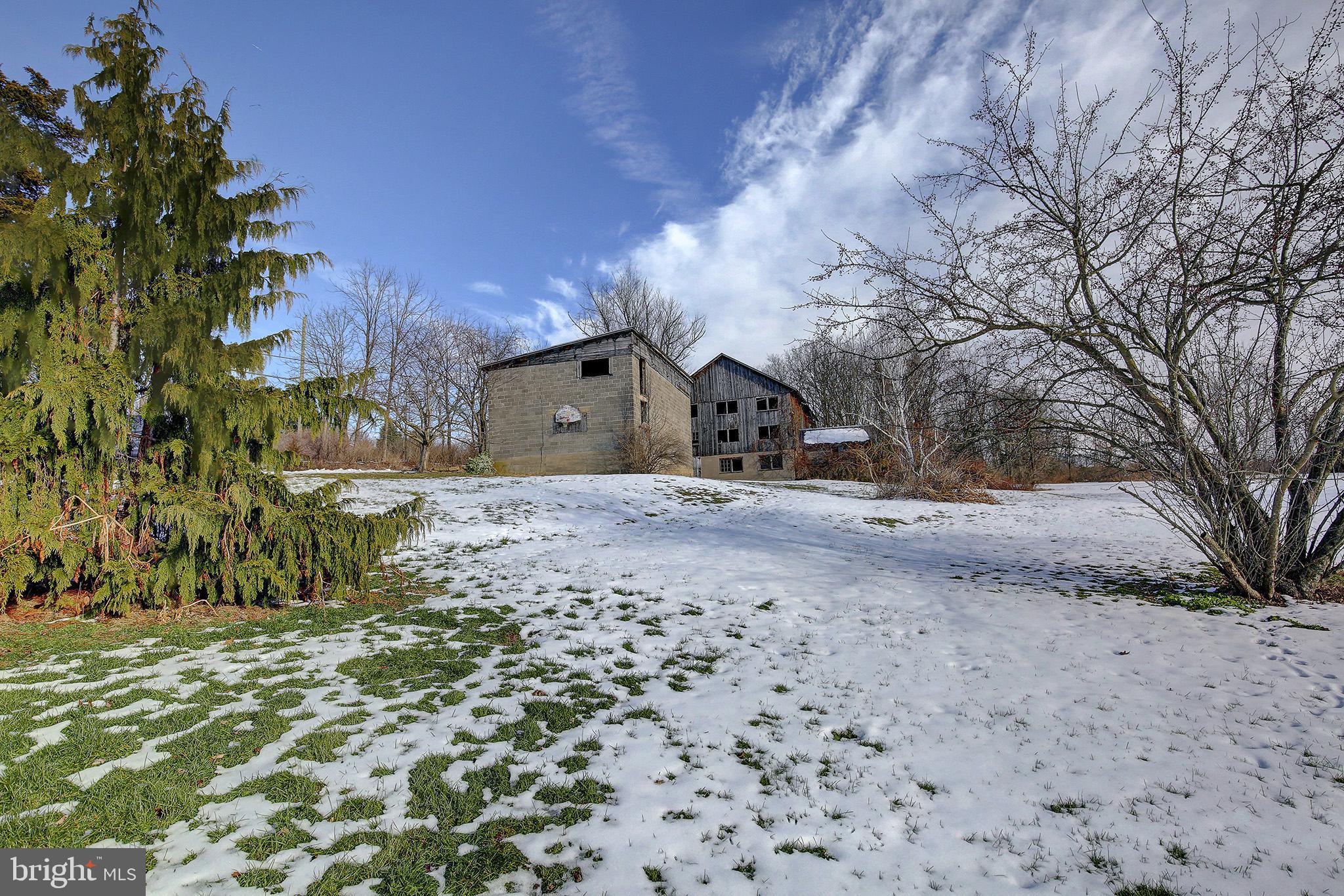 241 Earth Station Road Catawissa, PA 17820 - Photo 8 of 18 a view of a dirt road with a building in the background