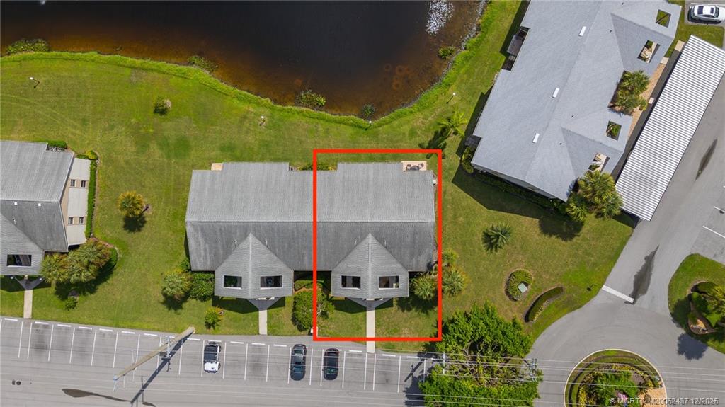3171 Southeast Aster Lane, Unit 1103 Stuart, FL 34994 - Photo 21 of 26 an aerial view of a house with a swimming pool
