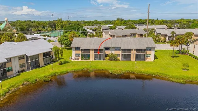 an aerial view of a house with a ocean view
