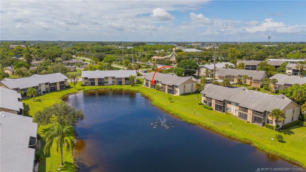 3171 Southeast Aster Lane, Unit 1103 Stuart, FL 34994 - Photo 23 of 26 a view of a city with lawn chairs