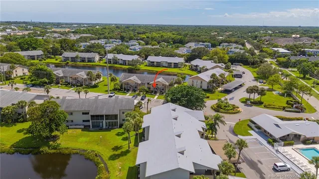 an aerial view of a house with a lake view