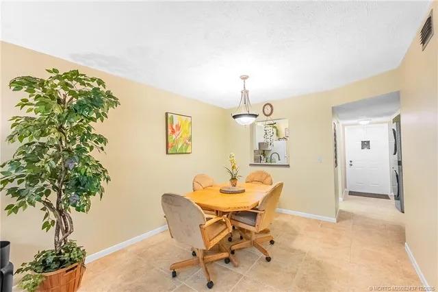 a view of a livingroom with furniture and a potted plant