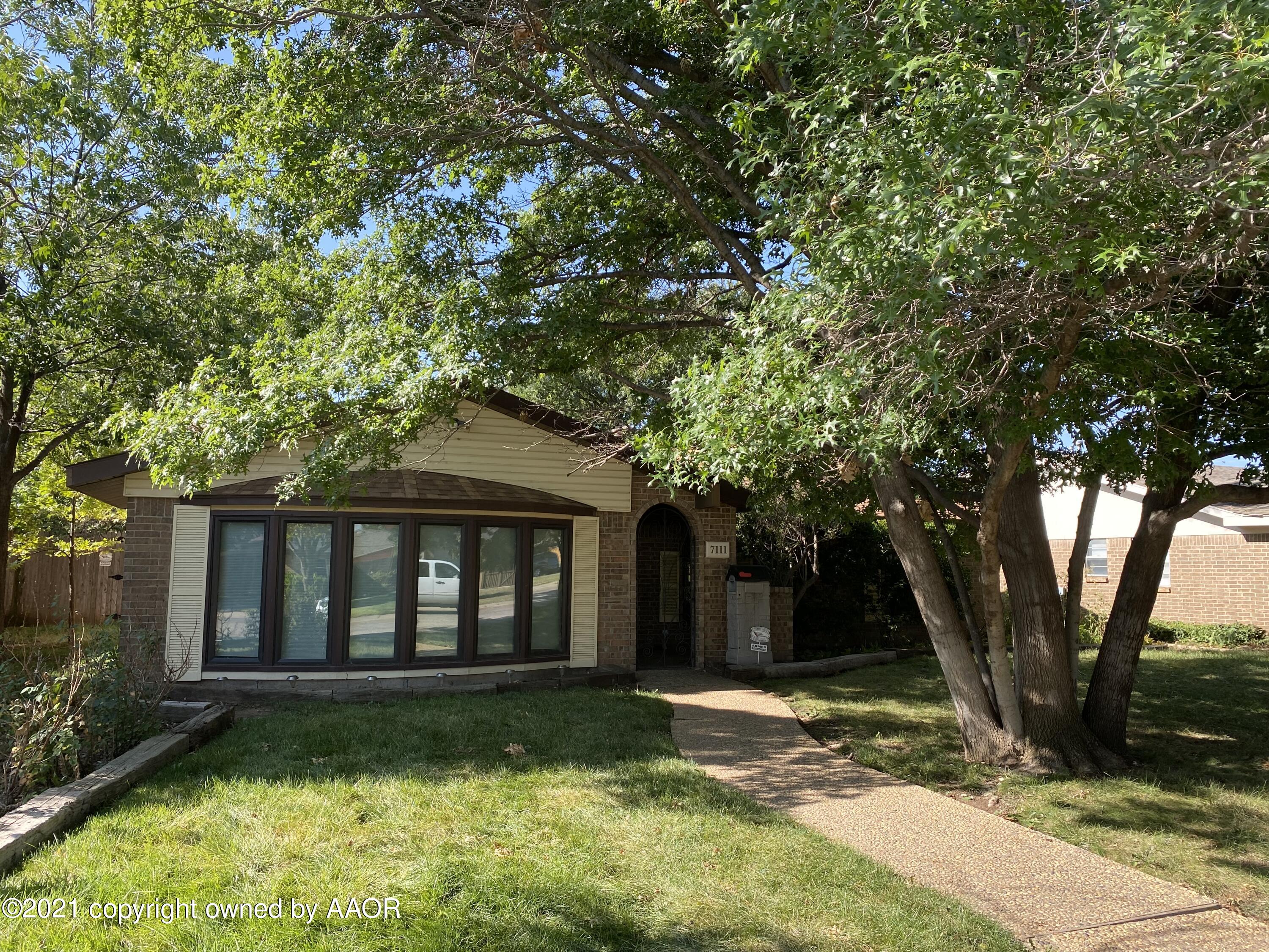 7111 Imperial Trail Amarillo, TX 79106 - Photo 1 of 13 a view of a yard in front of house