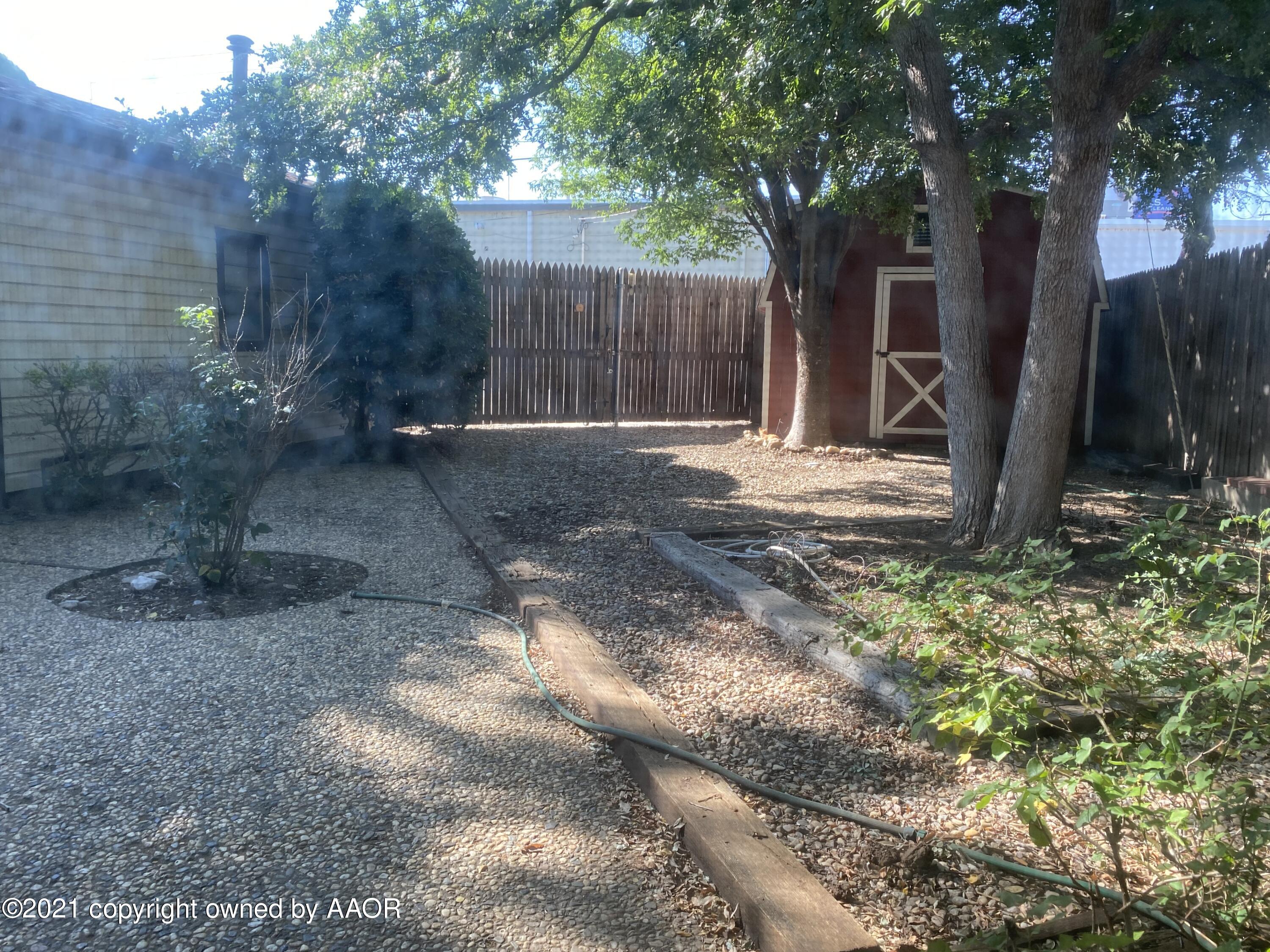 7111 Imperial Trail Amarillo, TX 79106 - Photo 13 of 13 a backyard of a house with lots of green space