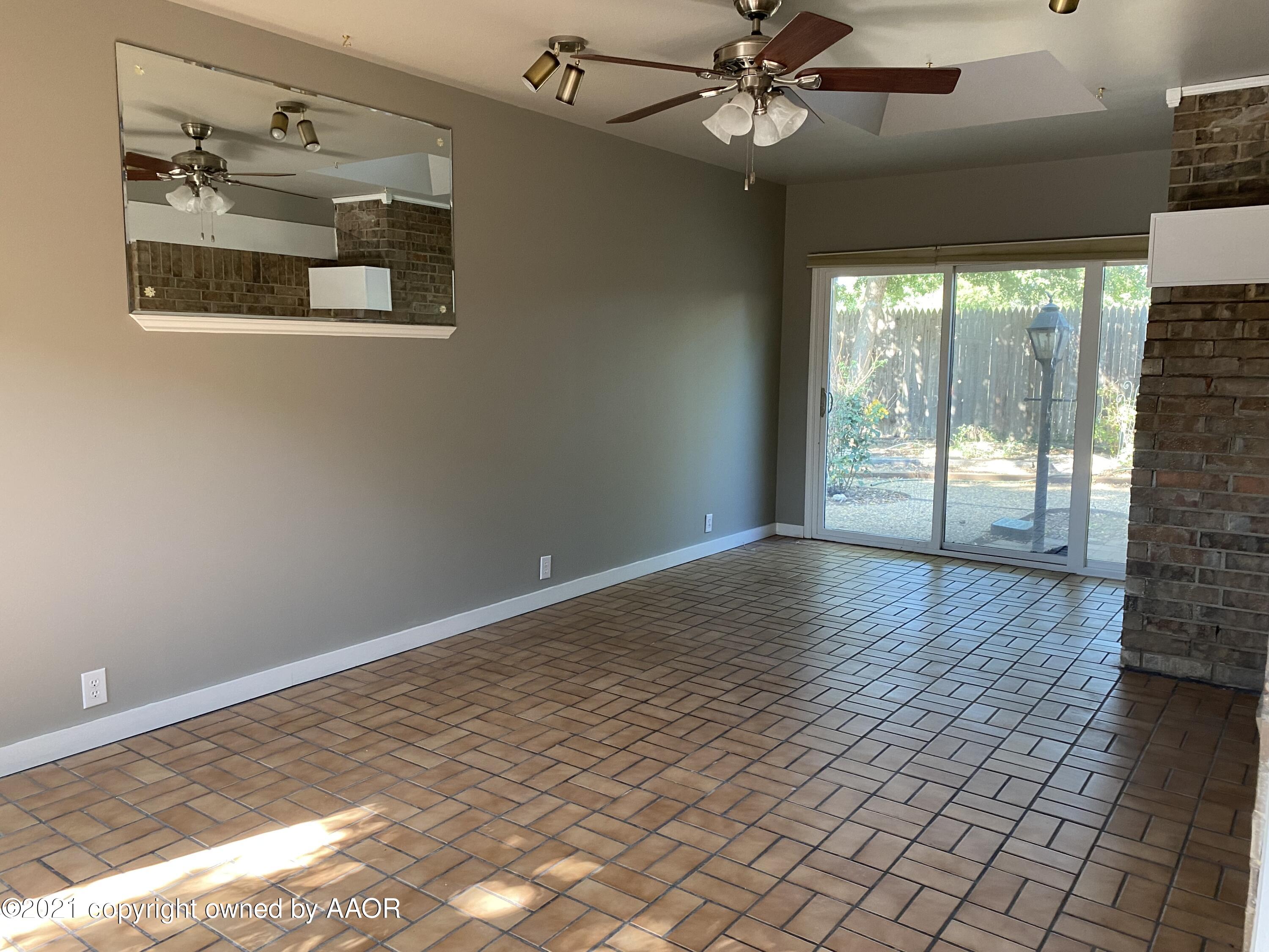 7111 Imperial Trail Amarillo, TX 79106 - Photo 7 of 13 a view of an empty room with a window