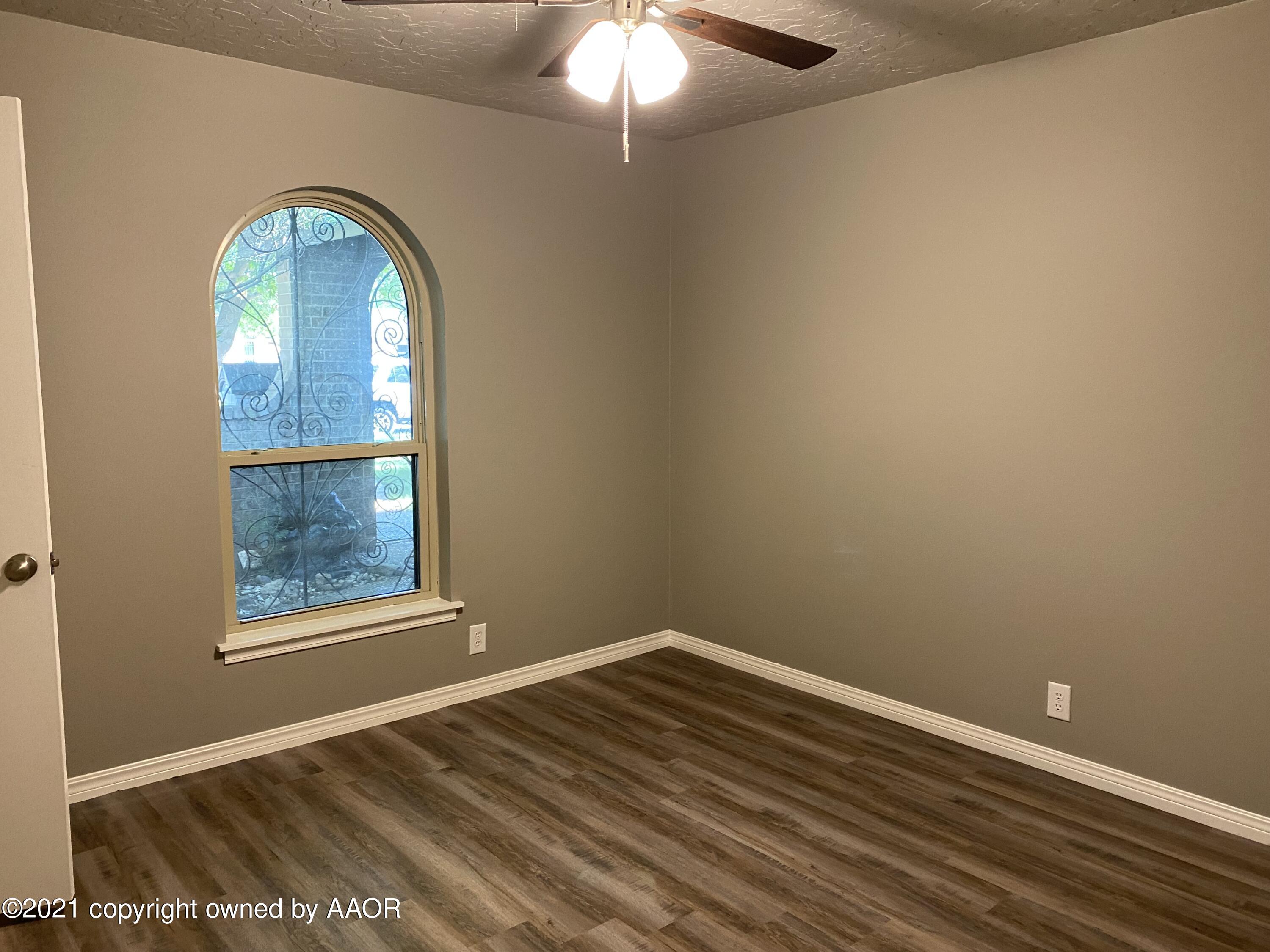 7111 Imperial Trail Amarillo, TX 79106 - Photo 10 of 13 an empty room with a window
