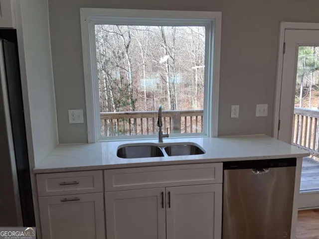 a kitchen with a sink and a window