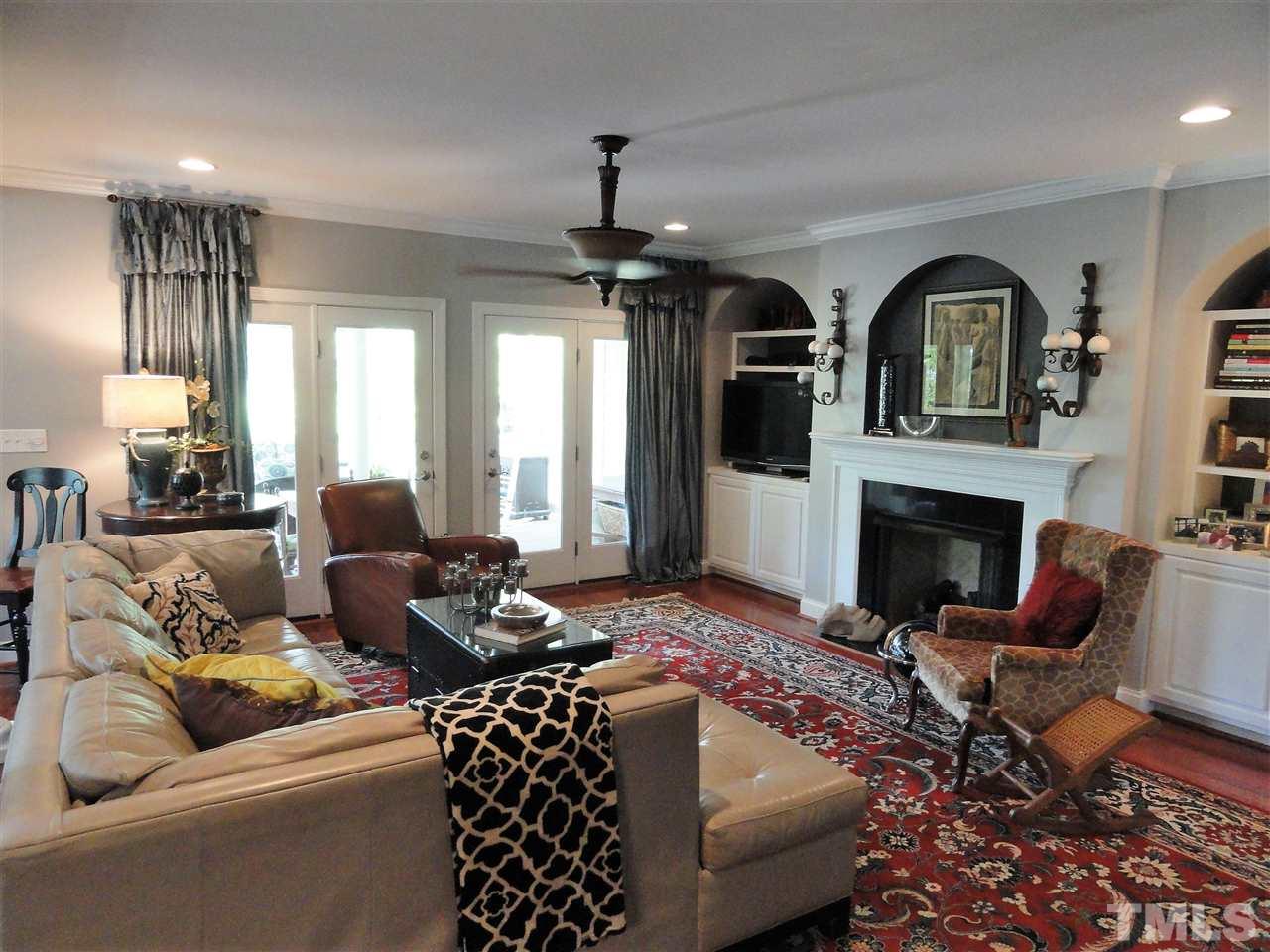 1004 Tyrrell Road Raleigh, NC 27609 - Photo 11 of 25 Family room with hardwood floors and brand new gas logs.