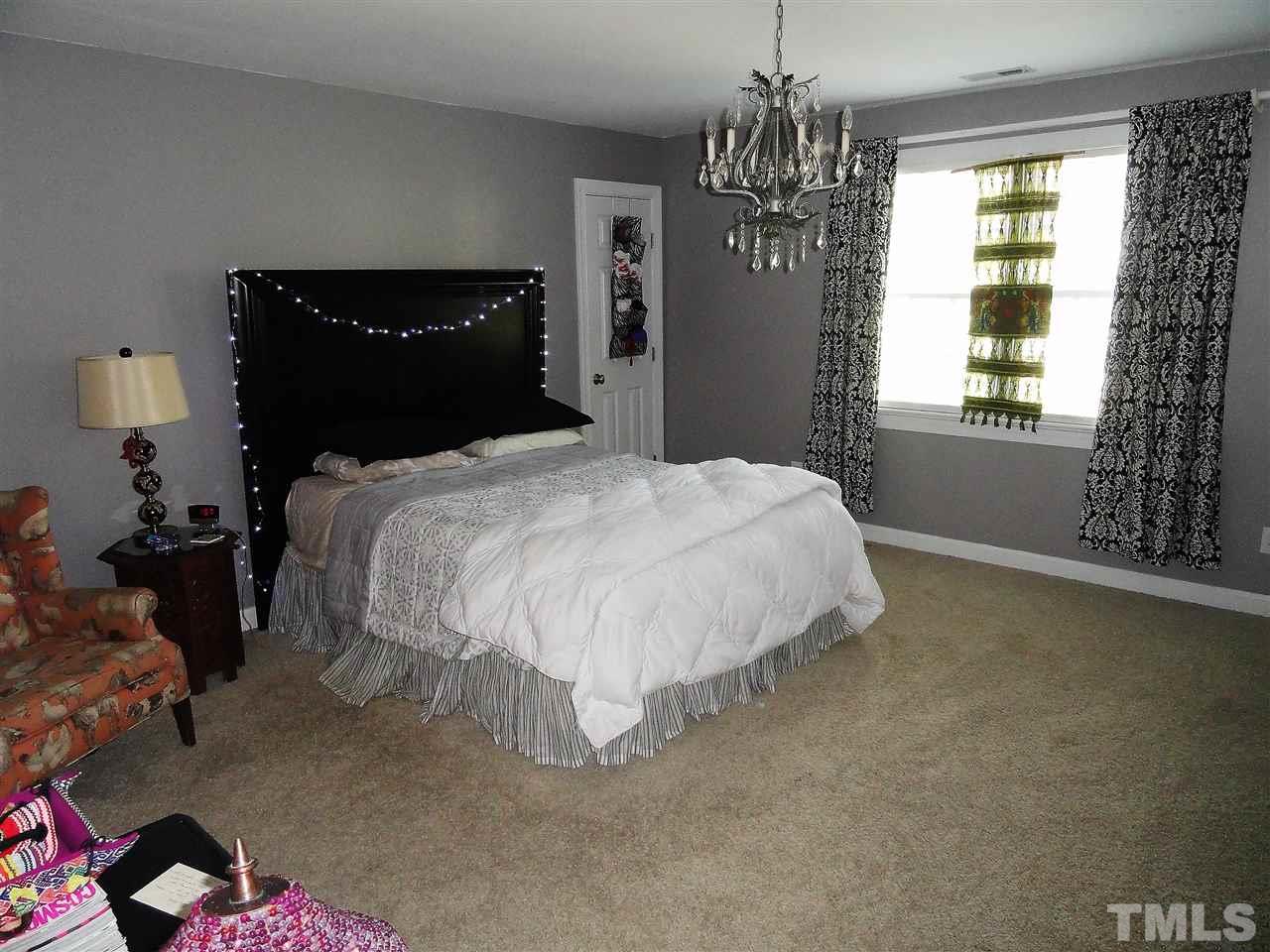 1004 Tyrrell Road Raleigh, NC 27609 - Photo 22 of 25 One of the three upstairs bedrooms! All 3 are a great size with walk in closets! This bedroom has it's own private full bath.